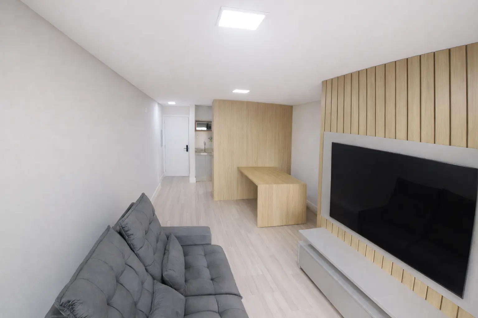 Sala de estar integrada do apartamento